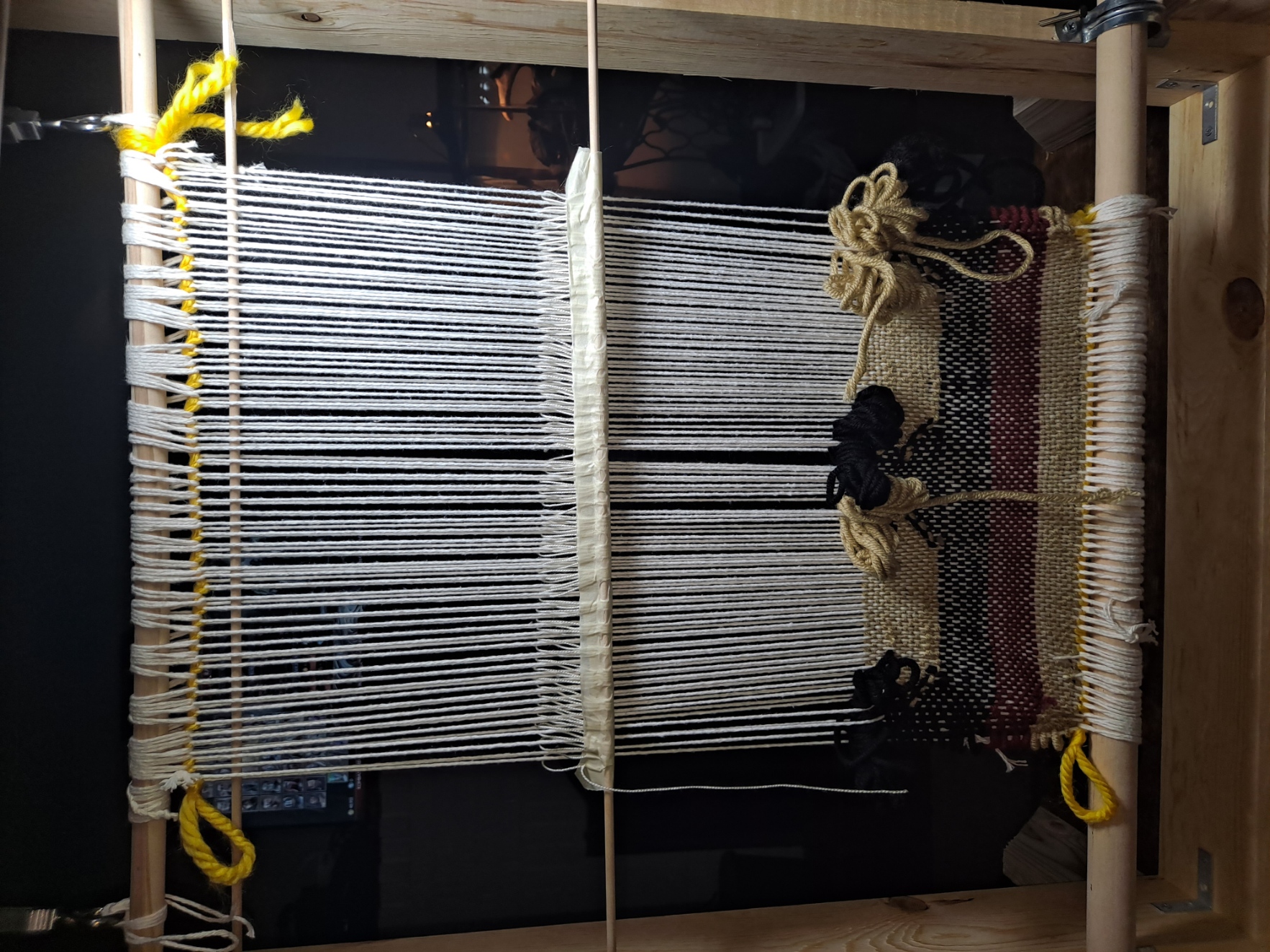 Partially woven navajo style loom.